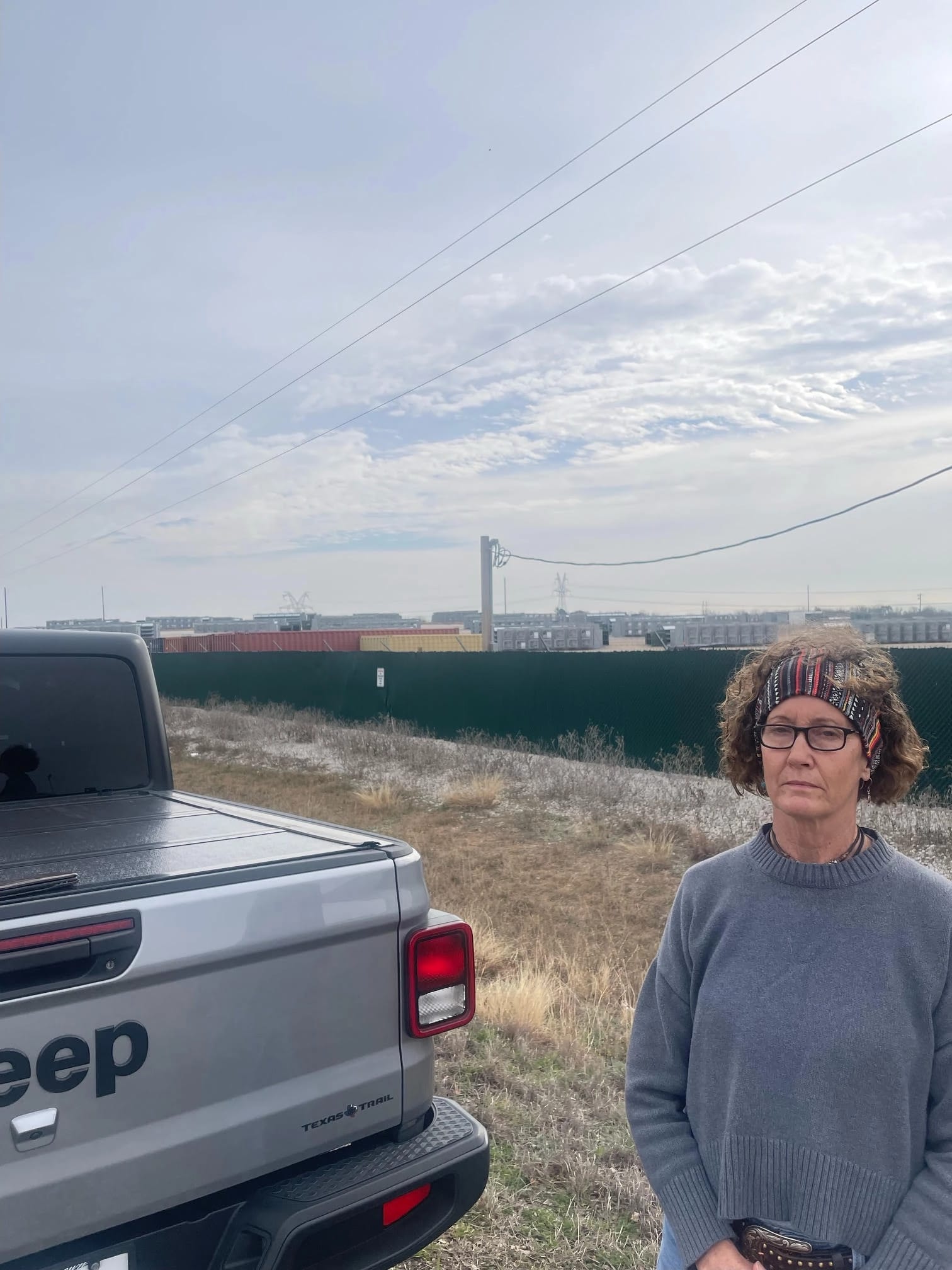 Cheryl Shadden in front of the Marathon Bitcoin mine.