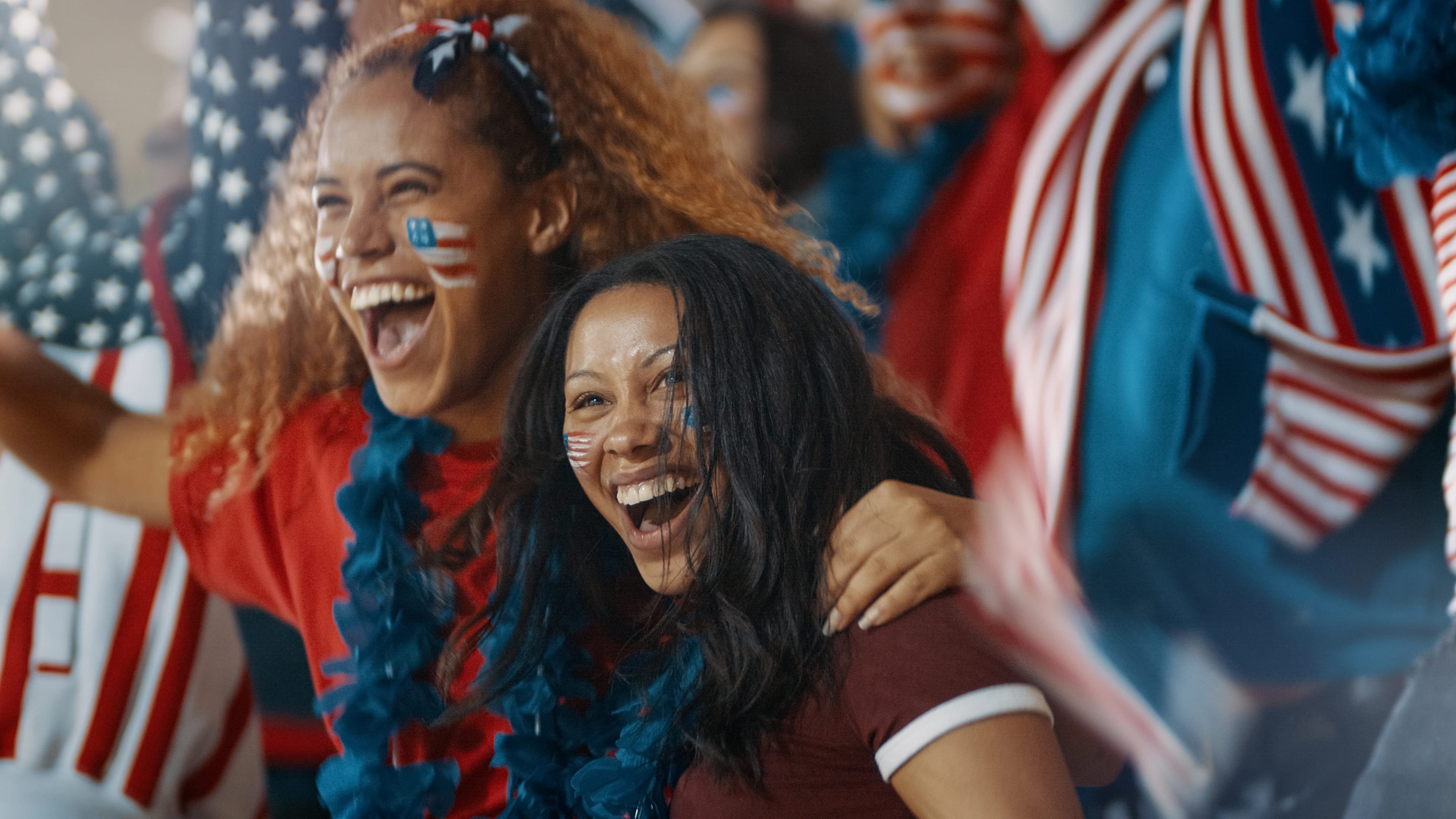 Excited,Fans,With,Us,Flag,In,Sports,Crowd,Celebrating,On