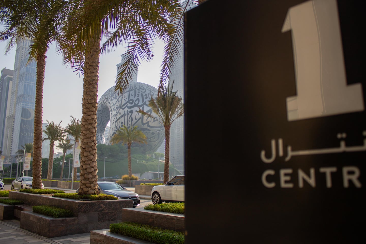 A sign for One Central is juxtaposed to the Museum of The Future