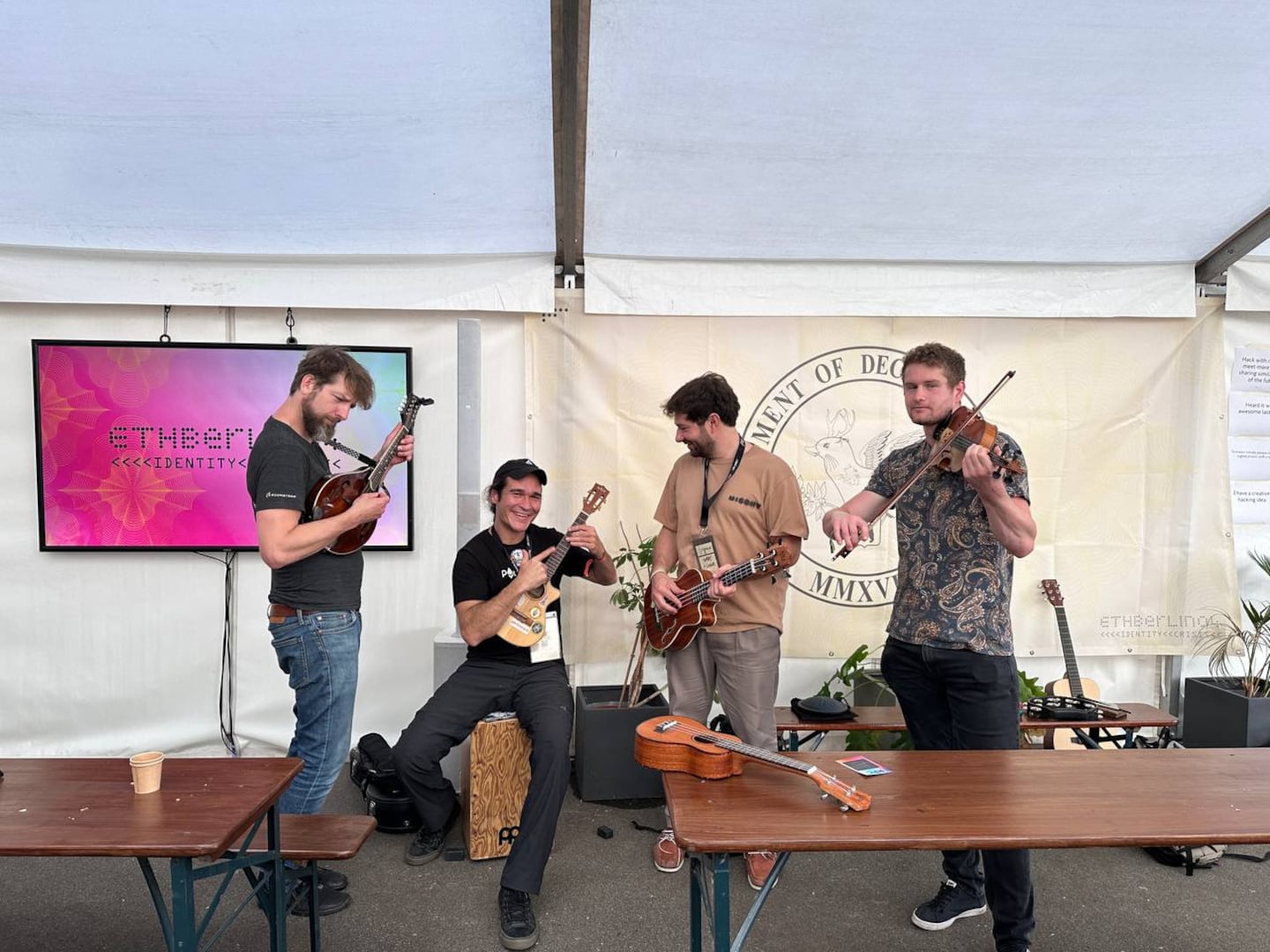 Volunteers and developers playing music at a hackathon in Berlin. Source: ETHBerlin.